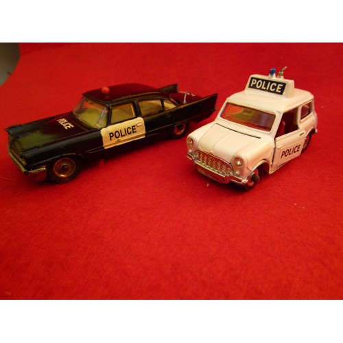 135 - Dinky Toys Desoto Fireflite Police Car and a Dinky Toys Mini Cooper Police car, both unboxed.