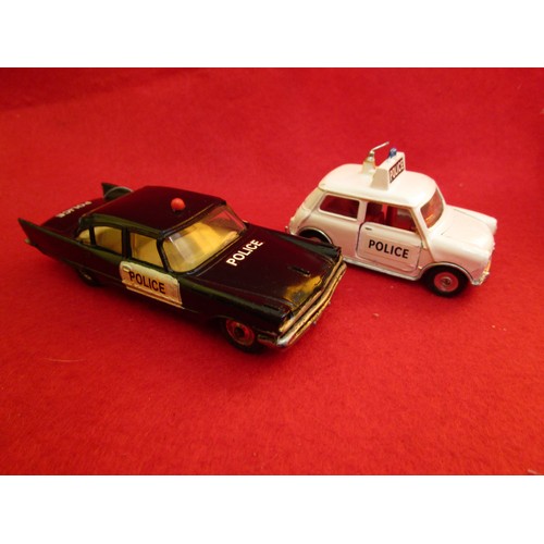 135 - Dinky Toys Desoto Fireflite Police Car and a Dinky Toys Mini Cooper Police car, both unboxed.