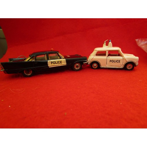 135 - Dinky Toys Desoto Fireflite Police Car and a Dinky Toys Mini Cooper Police car, both unboxed.