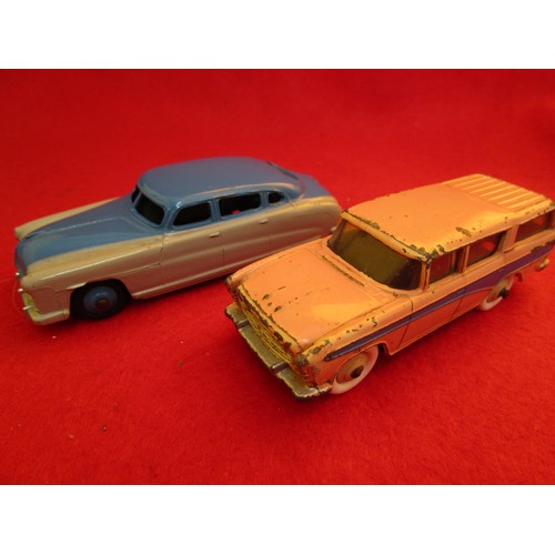 137 - Dinky Toys Hudson Sedan in dark blue over grey and a Dinky #173 Nash Rambler in pink with blue flash... 