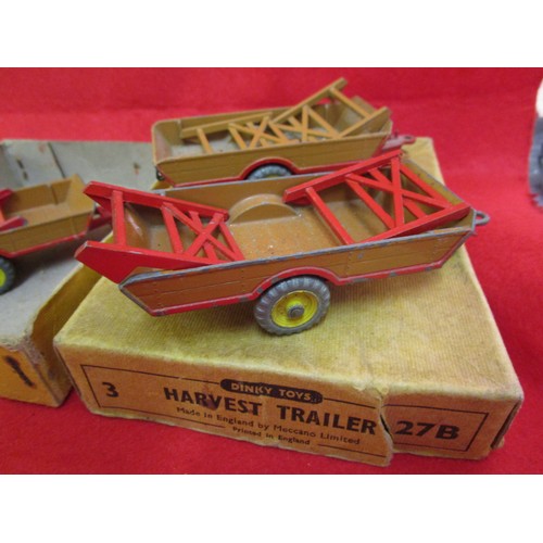 156 - A Dinky Toys trade box of 3 x 27B Harvest Trailers... box good with some marks, trailers have some m... 