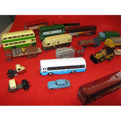 1069 - An assortment of die cast and plastic vehicles for N gauge railway layouts. The buses and items to t... 