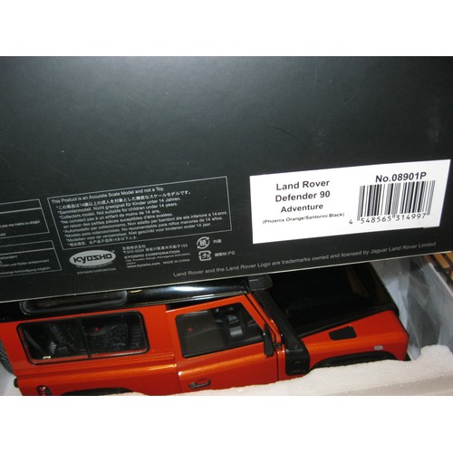 229 - A Kyosho Land Rover Defender 90 Adventure in Orange & Santorini Black, Dealer Model, boxed and mint ... 