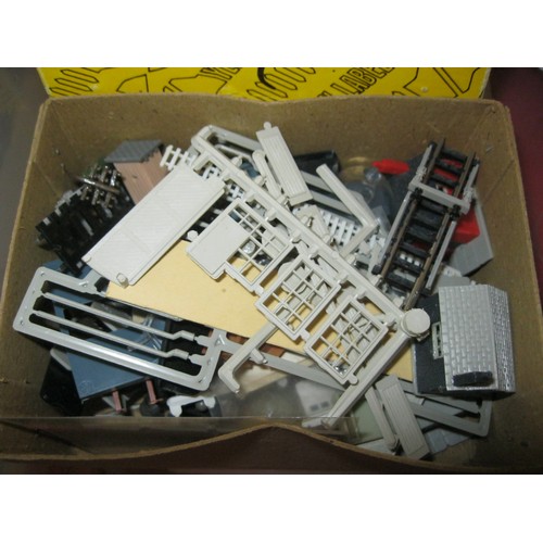 1071 - A tub of N gauge chassis, bodies and motors for spares plus a box of N gauge accessories and a bottl... 