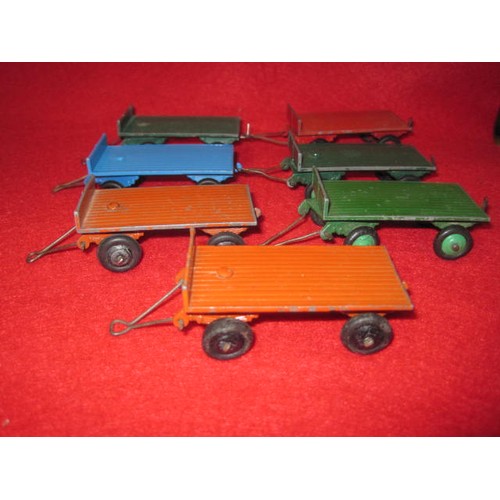 165 - 7 Dinky code 25 trailers in good condition 3 Green 2 Orange 1 Blue and 1 Red