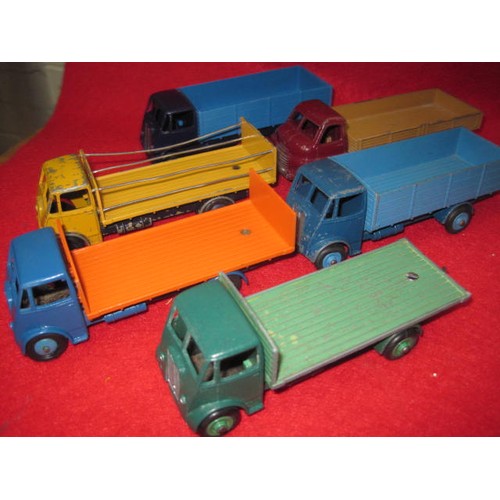 213 - Dinky supertoys Guy lorries  3 flatbed 2 low backed and a Dinky Big Bedford truck all in good condit... 