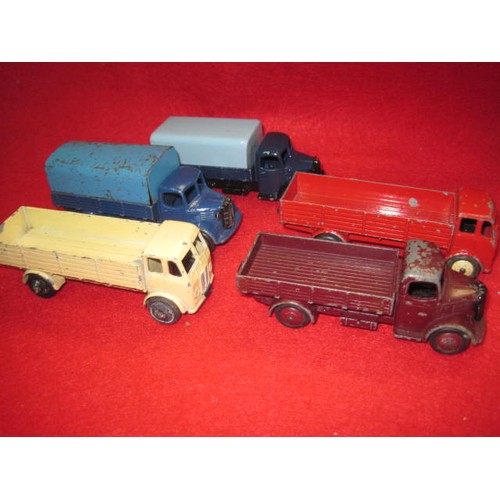 217 - 5 Assorted dinky flatbeds two with covers  all in fair to good condition