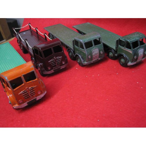 254 - 4 Dinky Foden flatbed lorries 2 Green 1 Maroon and a twintone green and Orange.