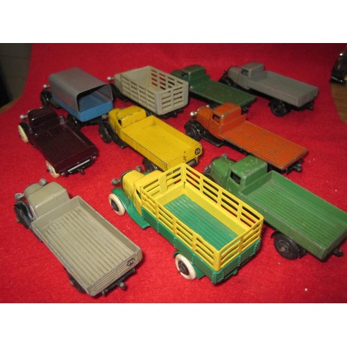 199 - 10 Dinky Tippers and rigid back 4 wheel lorrys in very good condition  2 highsided vehicles in the l... 