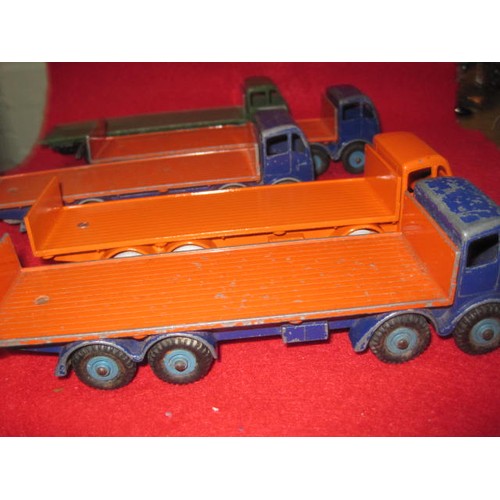 256 - 5 Dinky 8-wheel Foden lorries in good condition . 3 Blue and Orange 1 all Green and 1 all Orange