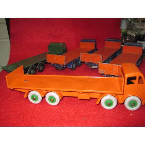 256 - 5 Dinky 8-wheel Foden lorries in good condition . 3 Blue and Orange 1 all Green and 1 all Orange