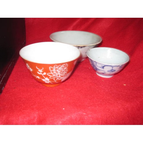 76 - A laquered teabox with Chinese and Japanese pottery