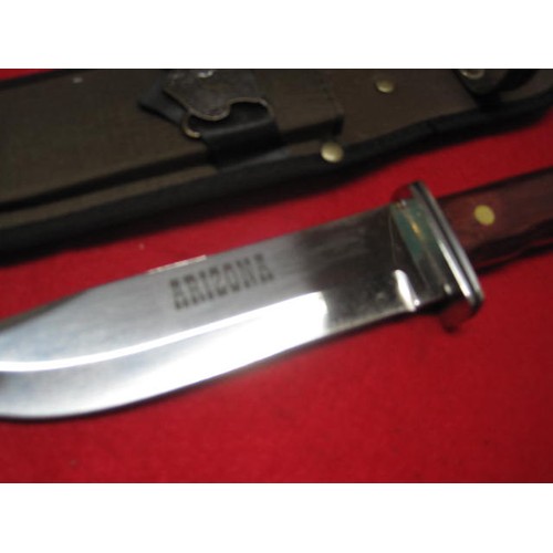 195 - A reproduction Eighth Air Force survival knife in scabbard with Tramontina blade, overall length app... 