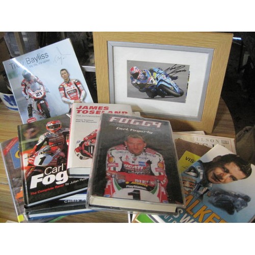 12 - A selection of books on motor and motorcycle racing including books signed by Carl Fogarty, Chris Wa... 