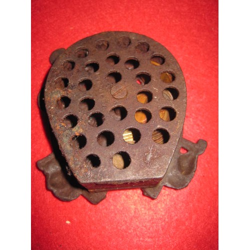 91 - A Tally-Ho Bank money box in cast iron, pre-WW1, contains a number of (unspectacular) ha'penny coins