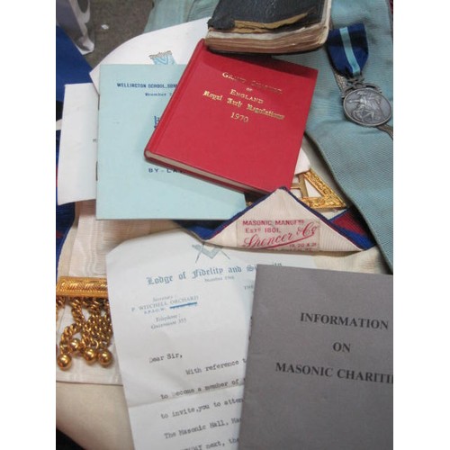 233 - A large assortment of Masonic items including Aprons (Craft and Royal Arch), jewels, books, a boxed ... 