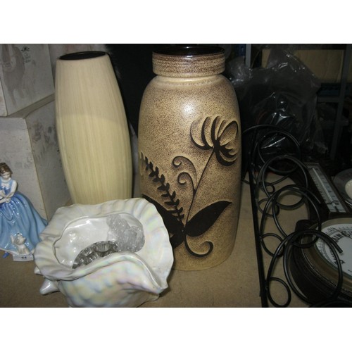 36 - A wrought iron wine rack, a West German vase and an interesting shell pot