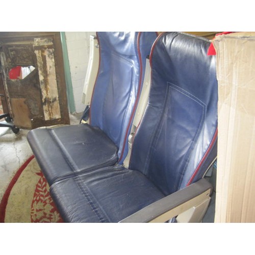 122 - A pair of airline seats previously from a Transaero 737, with seatbelts and safety cards.