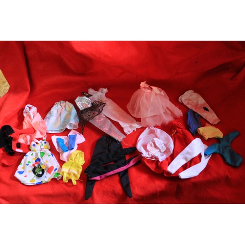 279 - A pair of vintage Barbie dolls in good condition plus two bags of accessories and clothes for the sa... 