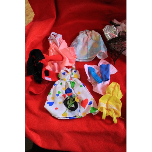 279 - A pair of vintage Barbie dolls in good condition plus two bags of accessories and clothes for the sa... 