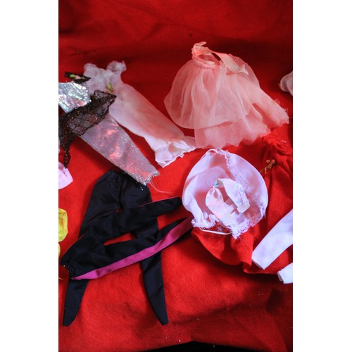 279 - A pair of vintage Barbie dolls in good condition plus two bags of accessories and clothes for the sa... 