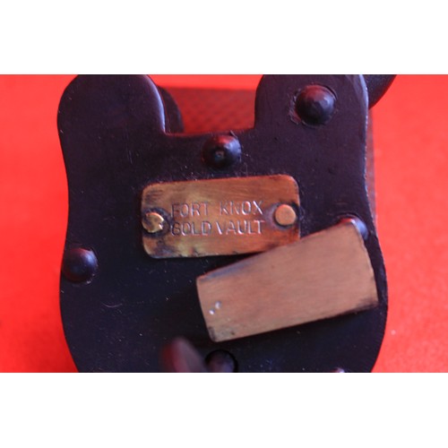 239 - A vintage black padlock with an attached tag reading 'Fort Knox Gold Vault'