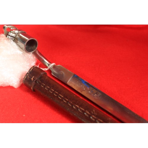 161 - A reproduction French socket bayonet in leather scabbard