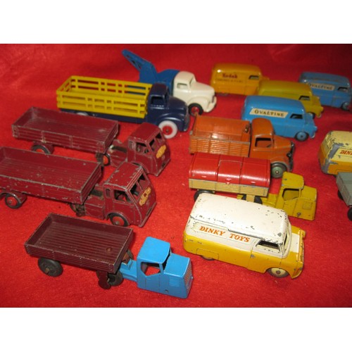 272 - An assortment of Dinky Toys commercial vehicles and trailers in playworn condition