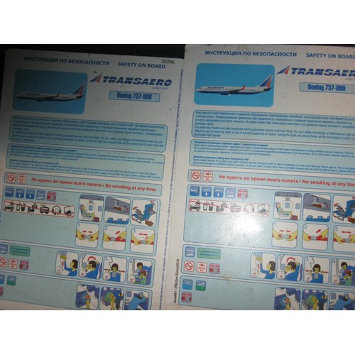 122 - A pair of airline seats previously from a Transaero 737, with seatbelts and safety cards.