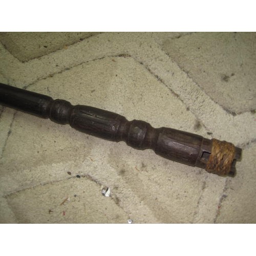 306 - An antique carved Indonesian staff