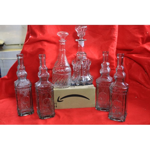 37 - A crate of mixed glassware including a number of decorative antique bottles marked 'Valencia', a sto... 