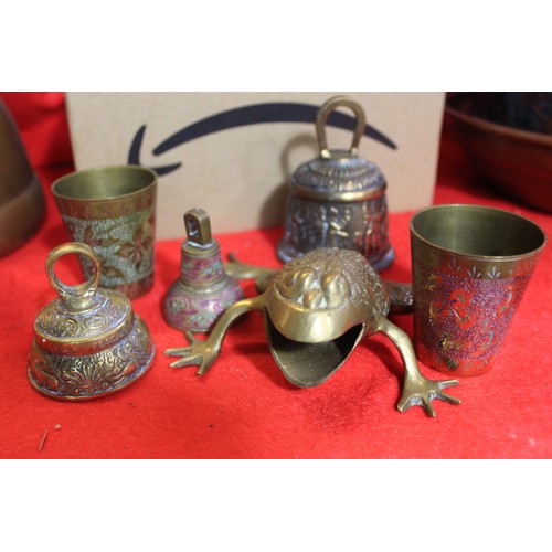 36 - An assortment of brass and copper items including kettles, figures, bells etc