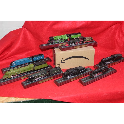 207 - A large collection of vintage plinth-mounted railway engines