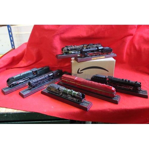 207 - A large collection of vintage plinth-mounted railway engines