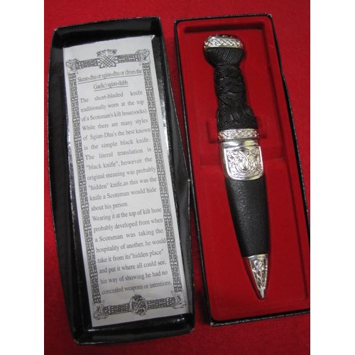 158 - A boxed 'Celtic Workshop' Skean-dhu knife with steel blade and white metal mounts in excellent unuse... 