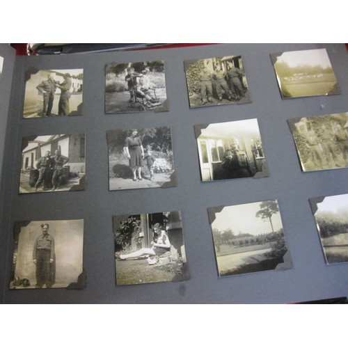 147 - A vintage photograph album containing pictures of military subjects including the funeral of King Ge... 