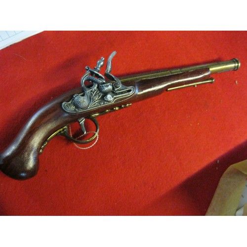 167 - A boxed Denix replica of a 1760 Hadlee of London Flintlock Coaching Pistol, box damp damaged but pis... 