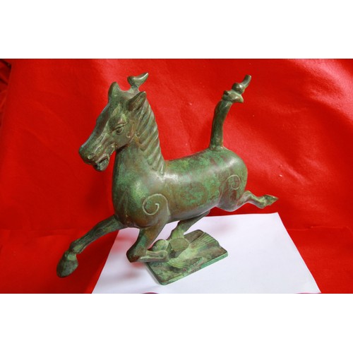 46 - An heavy Oriental bronze horse