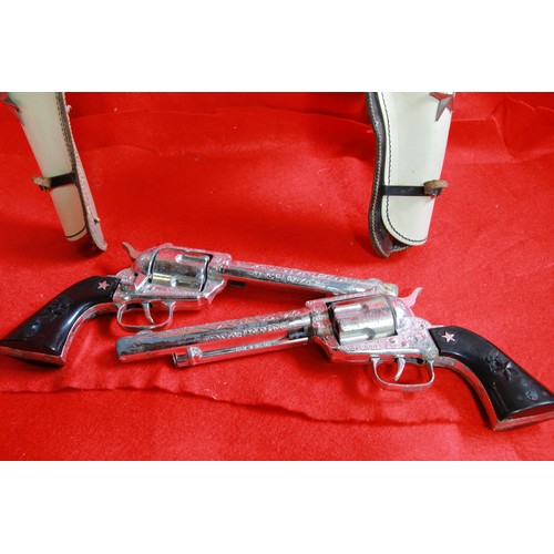 230 - A pair of Lone Star Cowboy guns in holster