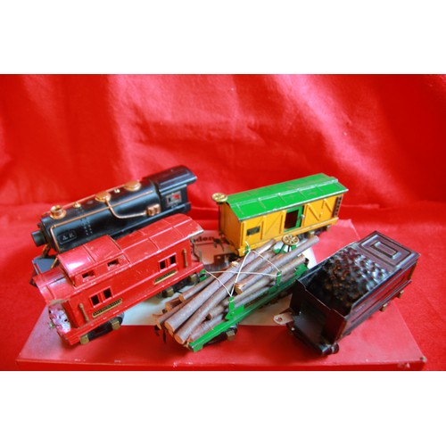 201 - An O Gauge model railway engine and goods wagons plus a selection of O gauge railway line