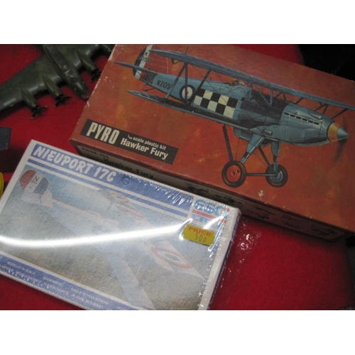 256 - A selection of vintage toys comprising a pair of models kits - A Pyro 1/48 Scale Hawker Fury and an ... 