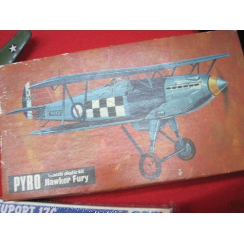 256 - A selection of vintage toys comprising a pair of models kits - A Pyro 1/48 Scale Hawker Fury and an ... 