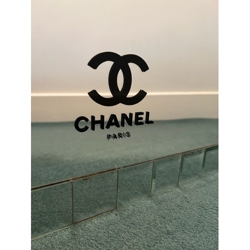 190 - A 600mm x 600mm mirror bearing 'Chanel' branding