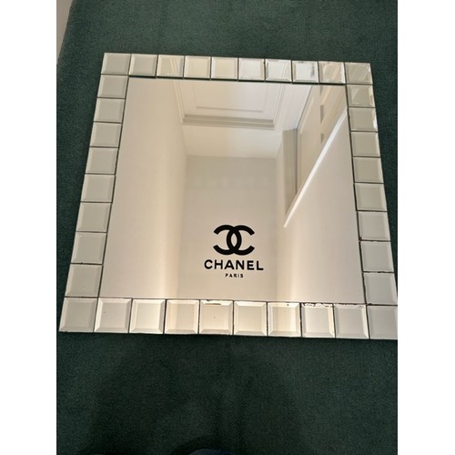 190 - A 600mm x 600mm mirror bearing 'Chanel' branding