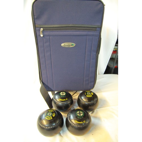 224 - A set of bowls in a wheeled Hensellite bag