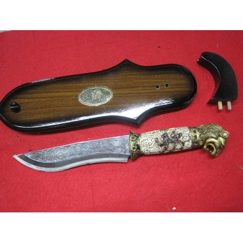 144 - A new and boxed ornate 'Lion Knife' with stand