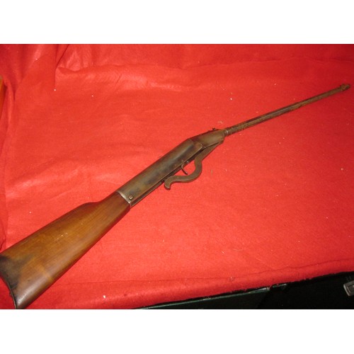 145 - An antique air rifle in .22 calibre, part octagonal barrel, break action, believed to be Belgian, wo... 