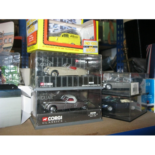 266 - An assortment of die cast vehicles by Corgi and others including a number of Jaguar cars etc