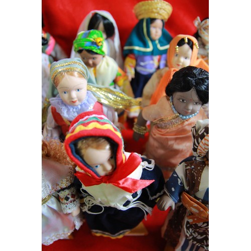 29 - A collection of 'Dolls of the World', plus stands