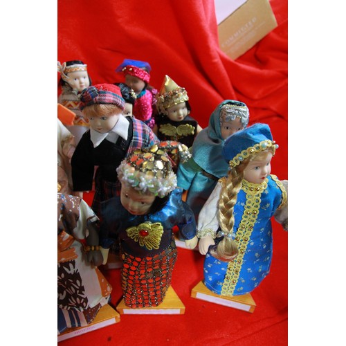 29 - A collection of 'Dolls of the World', plus stands